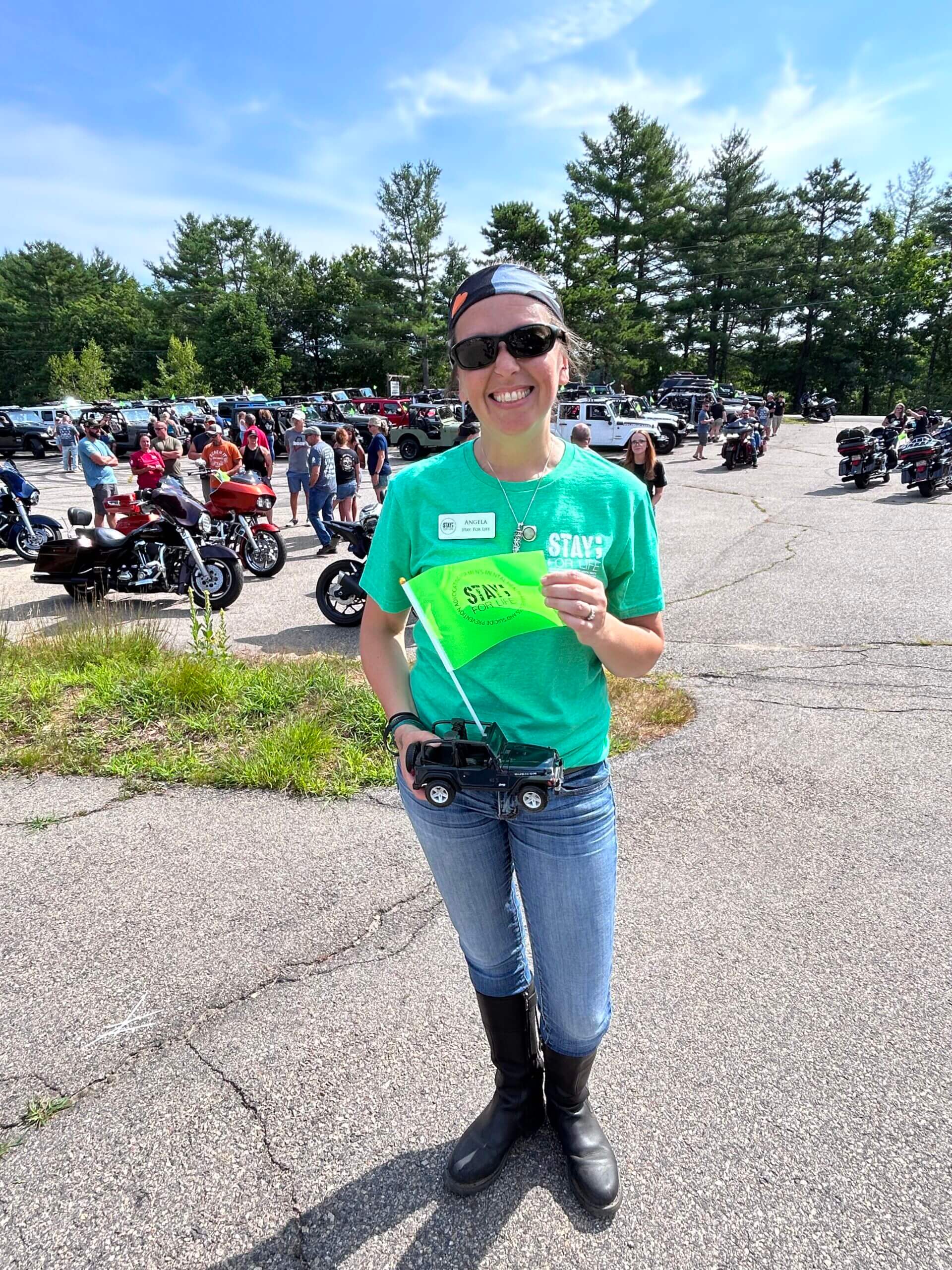 Angela at 2nd Annual SFL Jeep & Motorcycle Ride holding flag