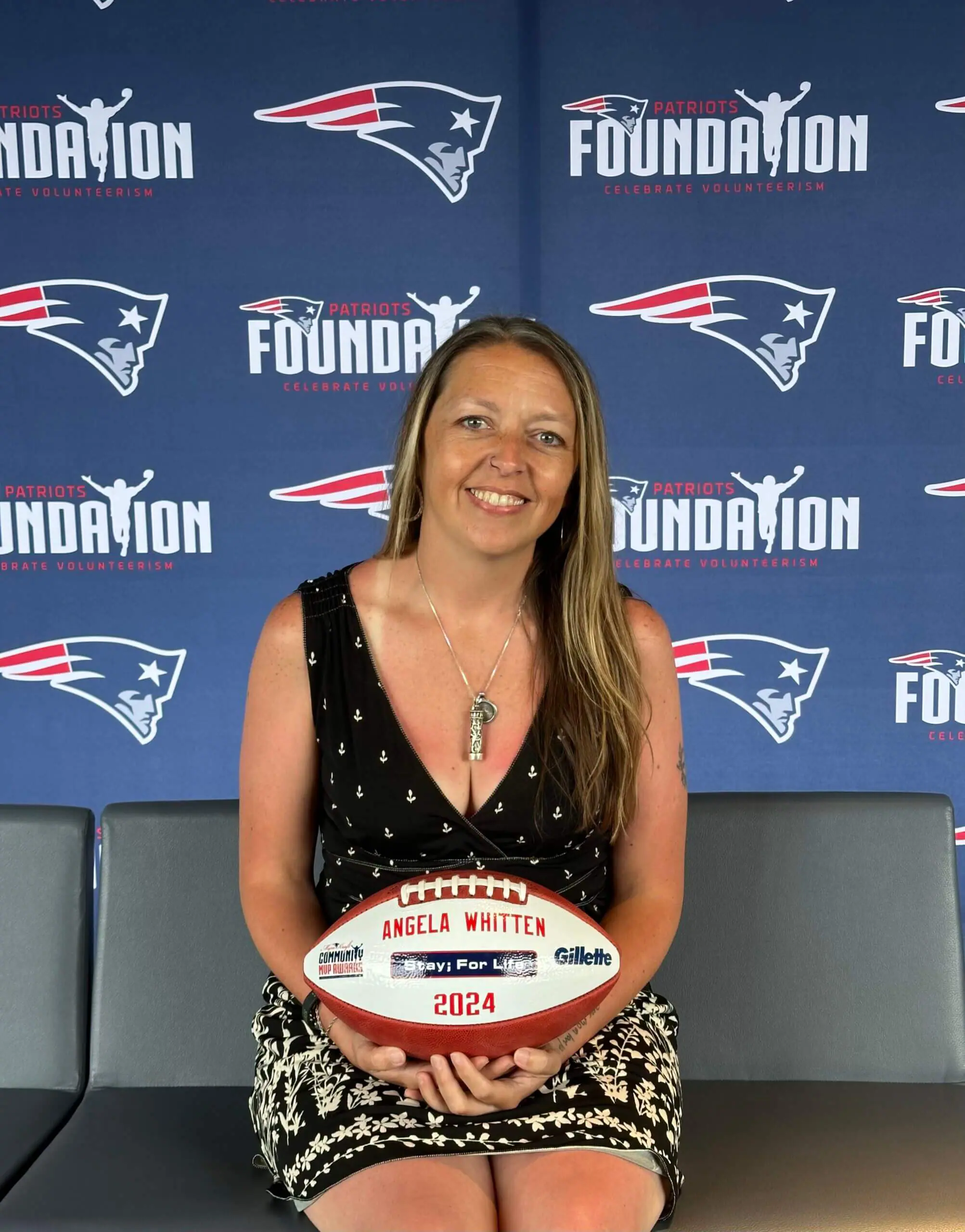 Angela holding Myra Kraft Award